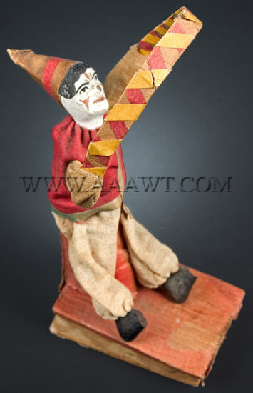 Antique Squeak Toy, Clown with Hoop, angle view